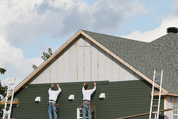 Professional Storm Damage Siding Repair technician working in De Mossville, KY